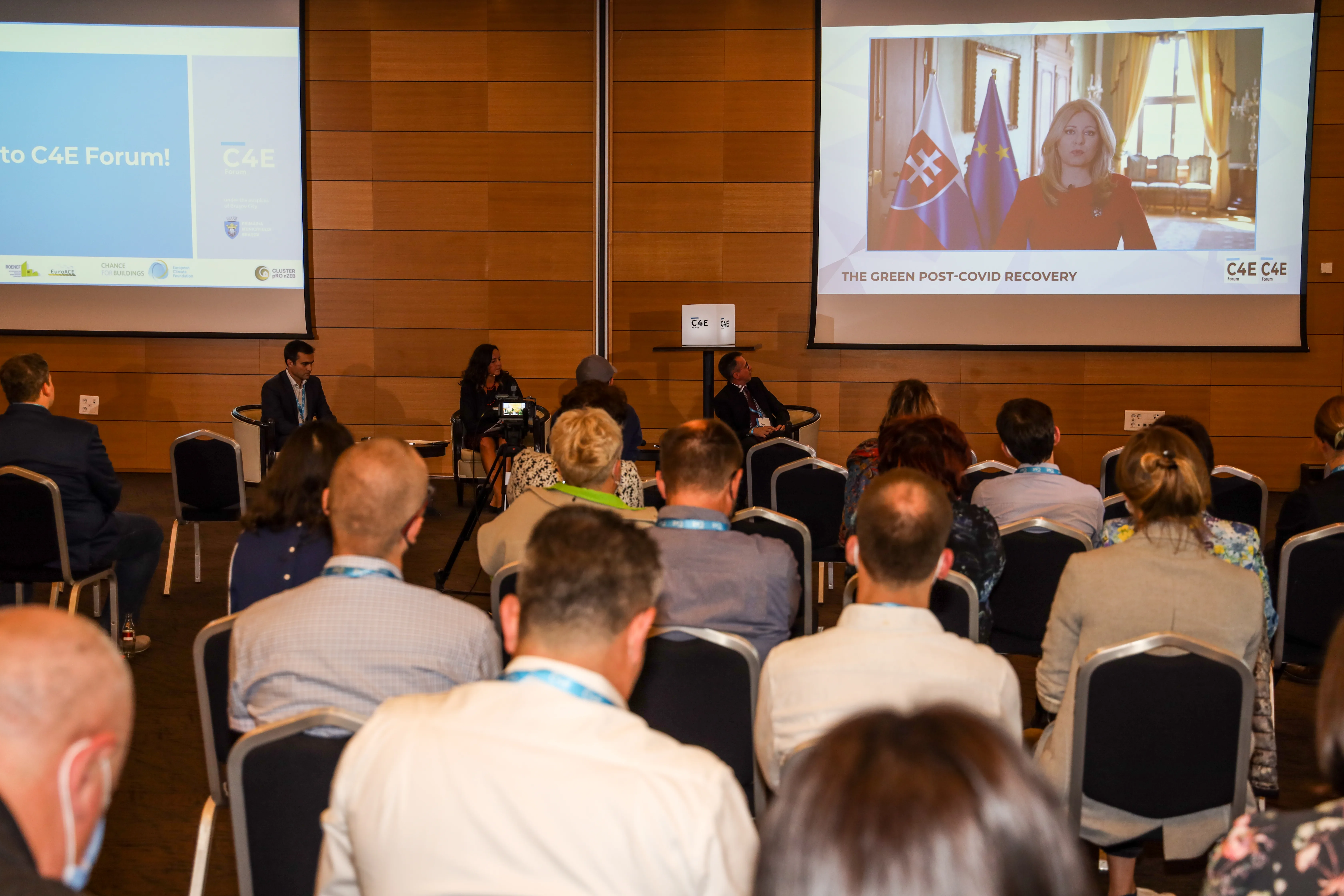 C4E Forum audience watching President Zuzana Čaputová's recorded address.