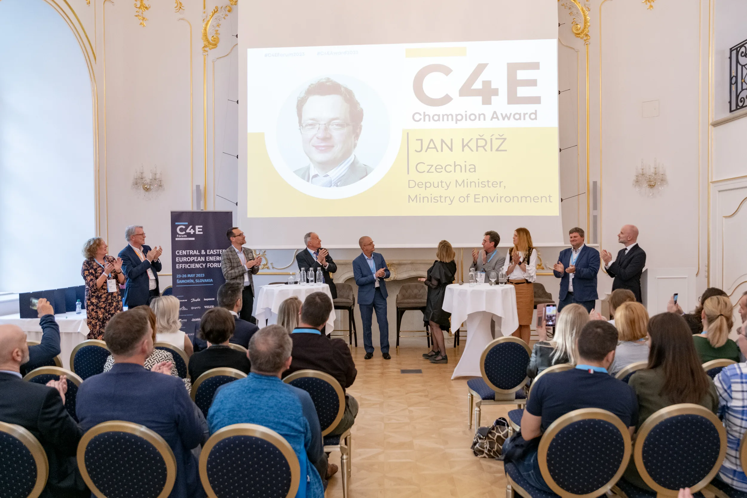 Jan Kříž receiving the C4E Champion Award 2023